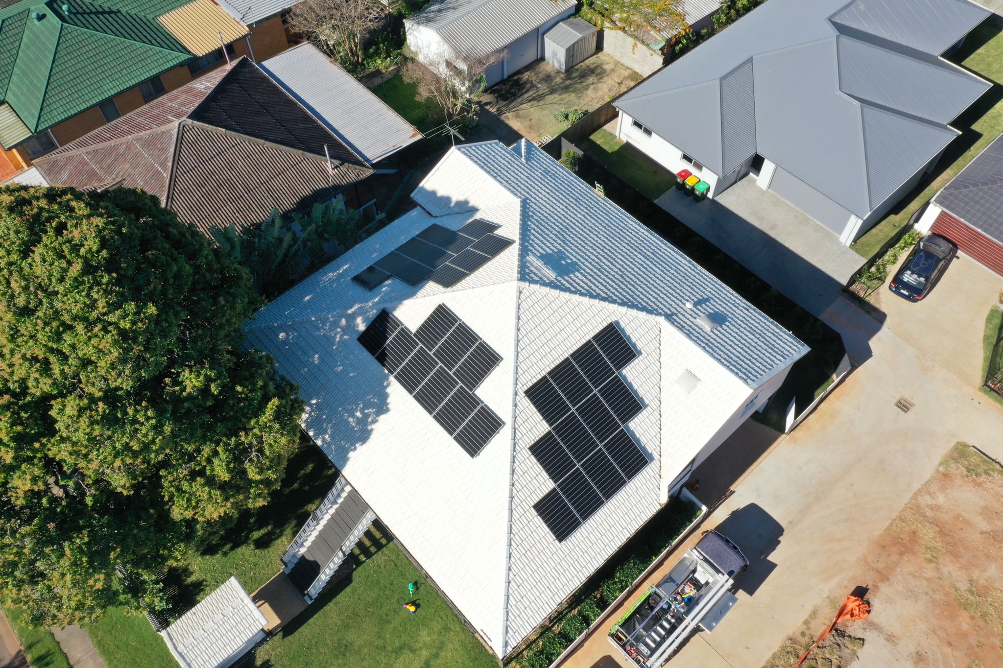 Drone image looking at roof with new solar panels installed by Sunlogics